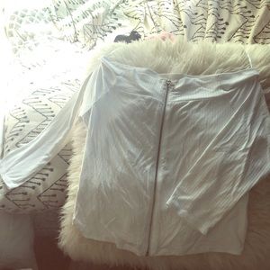 White shoulder-less top.